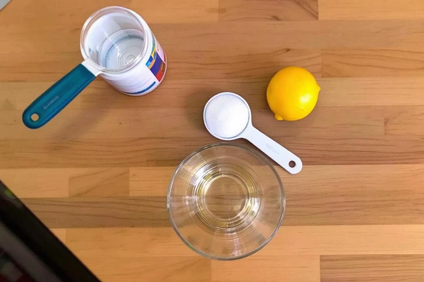 Homemade flower food ingredients: sugar, lemon, and water in vase